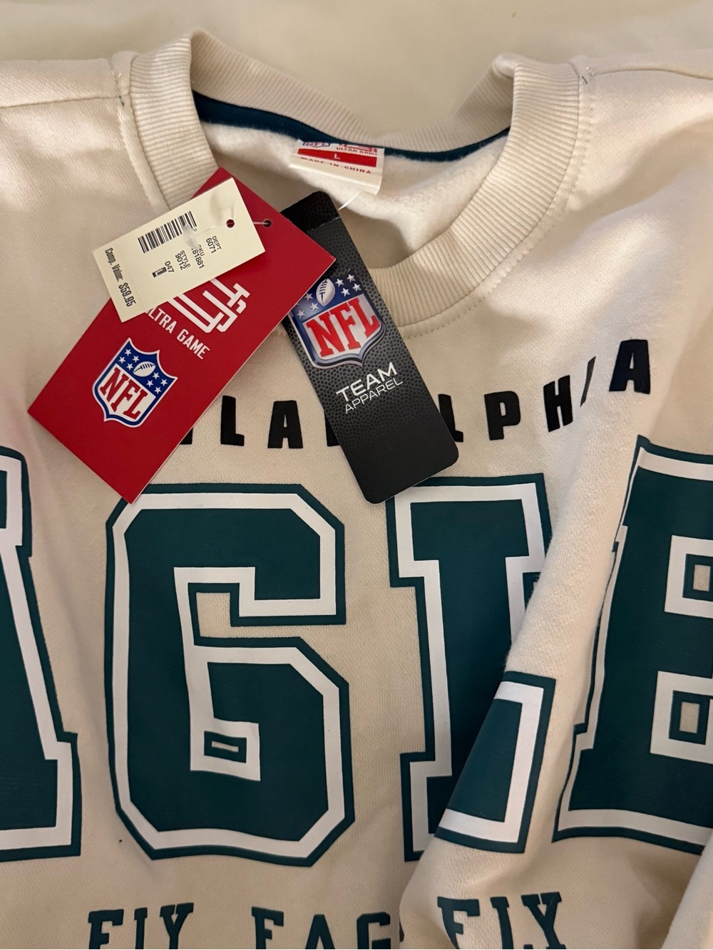 NFL White Sweatshirt with Teal Graphic Numbers